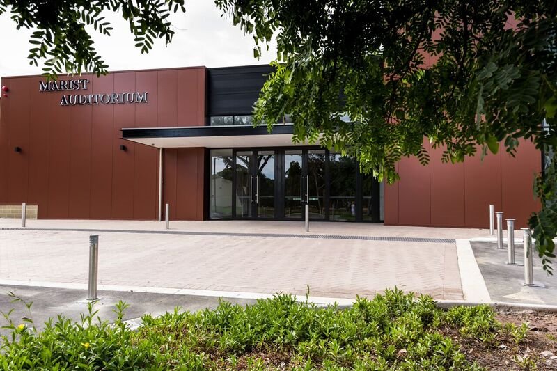 The COLORBOND® Metallic steel colour Aries® – a rich, deep red with a touch of theatrical brilliance – plays a starring role in Newman College's Marist Auditorium.