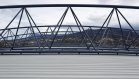 The roof cladding – Fielders HiKlip® 630 made from COLORBOND® steel in the colour Shale Grey™ is suspended below the curving roof trusses